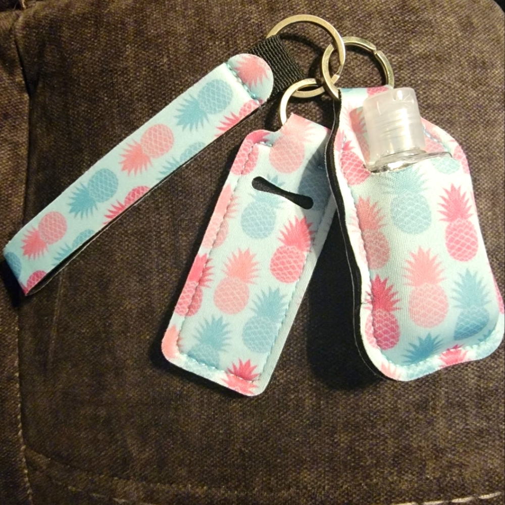 Travel hand sanitizer and chapstick holder